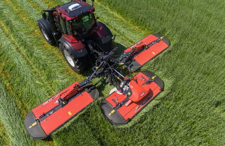 PZ 8831 triple drum mower working in the field
