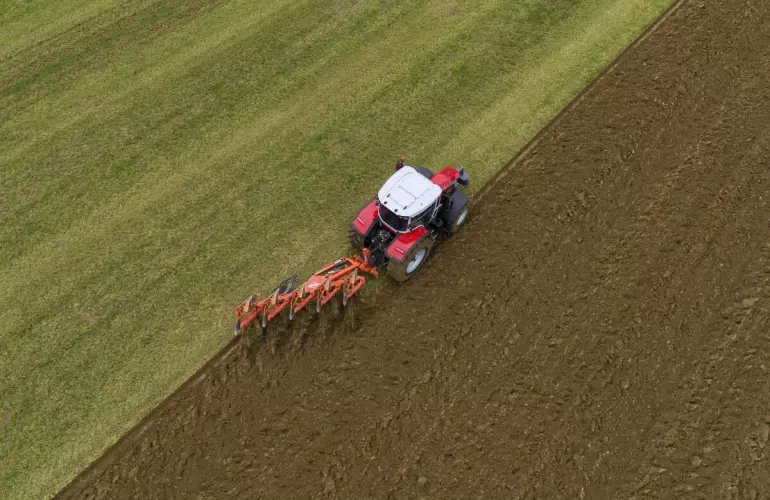 Mounted Reversible Plough Master working in a field
